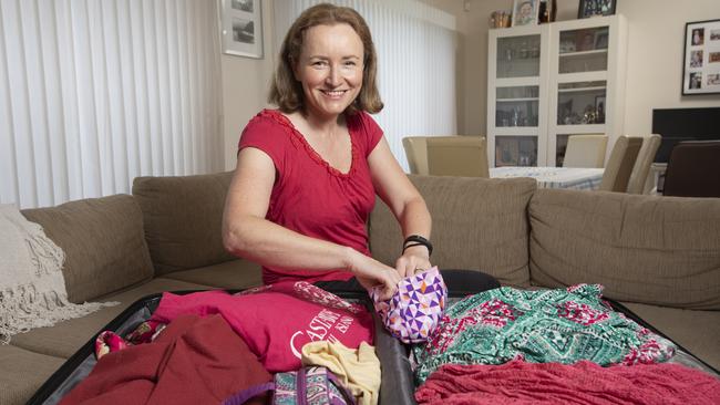 Sydneysider Susan Griffiths packs her bags for a Monday take-off to the Spanish Canary Islands, where she will see her family for the first time in more than two years. Picture: Chris Pavlich