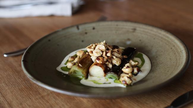 Templo’s braised leeks with buttermilk dressing, hazelnuts and leek-top oil. Picture: LUKE BOWDEN