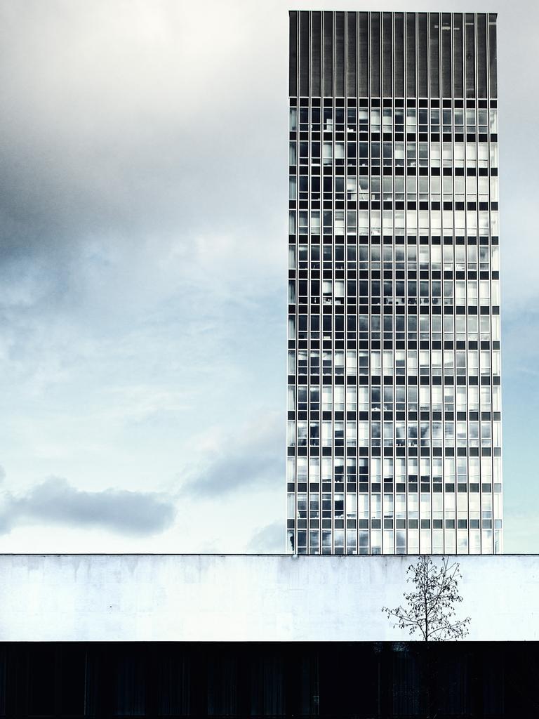 The Landscape Photographer of the Year: The Arts Tower, Sheffield, South Yorkshire, England by Daniel Cook (S Yorks) — Winner, Urban view 2014 ‘The Arts Tower is England’s tallest University Building. It was built in the 1960s and appears to have been inspired by the New York City skyscrapers of that time. Despite a recent refurbishment, the architecture still conveys a sense of clinical minimalism with square edges and plain patterns. This photo was taken from the public park and duck pond, which sit at the base of the tower, on a day I was trying out some new equipment. When walking around the area, I noticed the position of the small, bare tree contrasting with the light wall. Initially, I tried to capture the tower reflected in the water of the pond but then felt that conveying the clinical feel of the architecture alone would create a stronger image. I also wanted to make the most of the strong line of the building in the foreground, which was at right angles to the tower itself.’. <a href="http://www.take-a-view.co.uk/" target="_blank">Find out more here. </a>