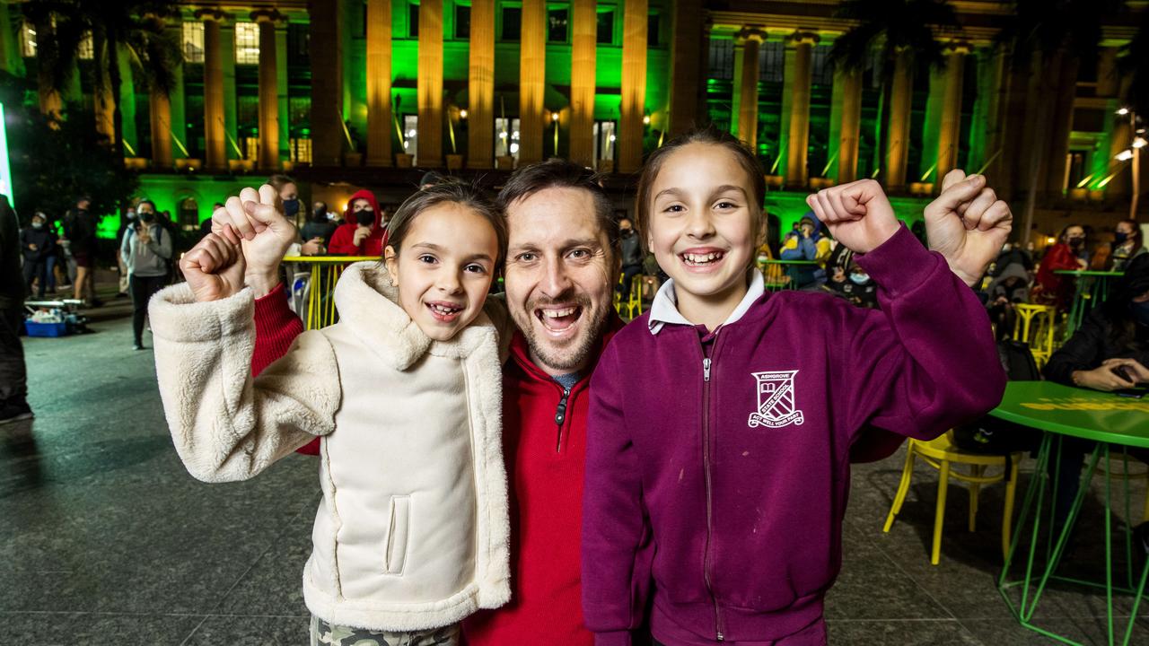 Stephen Glowacz with his daughters Georgia and Giselle celebrate Brisbane’s Olympic Games win. Picture: Richard Walker