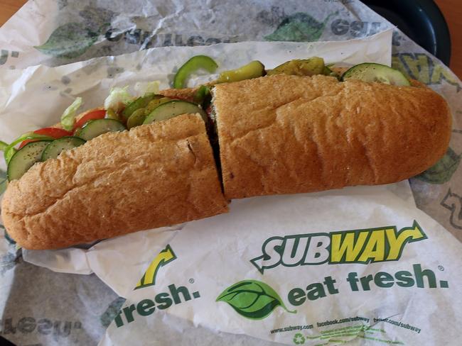 MIAMI, FL - OCTOBER 21: A Subway sandwich is seen in a restaurant as the company announced a settlement over a class-action lawsuit that alleged that Subway engaged in deceptive marketing for its 6-inch and 12-inch sandwiches and served customers less food than they were paying for on October 21, 2015 in Miami, Florida. While it denies the claims, Subway said that franchisees would be required to have a measurement tool in stores to make sure loaves are 12-inches. Joe Raedle/Getty Images/AFP == FOR NEWSPAPERS, INTERNET, TELCOS & TELEVISION USE ONLY ==