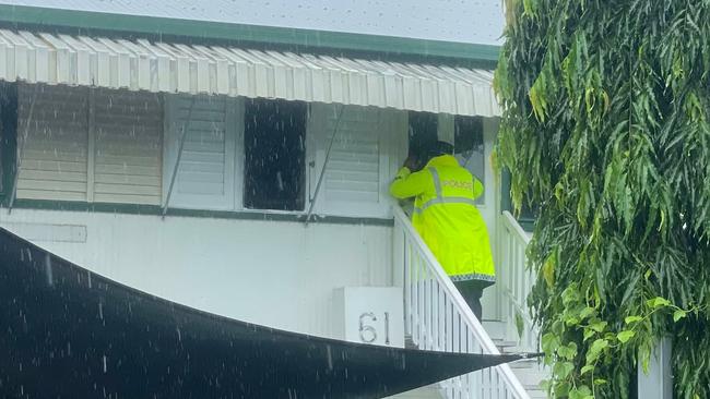 Police at the door of a prperty on 12th Ave, Railway Estate.