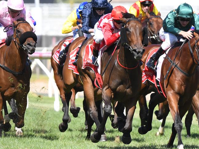 Jockey Craig Williams riding Catchy (C) to win the Ladbrokes Blue Diamond Stakes from Paraiah (R) Blue Diamond Stakes Day at Caulfield Racecourse in Melbourne, Saturday. Feb. 25, 2017. (AAP Image/Mal Fairclough) NO ARCHIVING, EDITORIAL USE ONLY