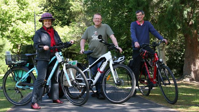 Bicycle Network Tasmania social rides co-ordinator Di Elliffe, children's book illustrator Tony Flowers and Tasmanian Renewable Energy Alliance executive officer Jack Gilding on an e-bike ride in South Hobart’s Cascade Gardens. <br/>Picture: AMANDA DUCKER