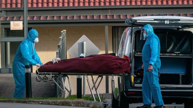 The body of a patient who died at St Basil’s aged-care home in Fawkner is taken away. Picture: Jason Edwards