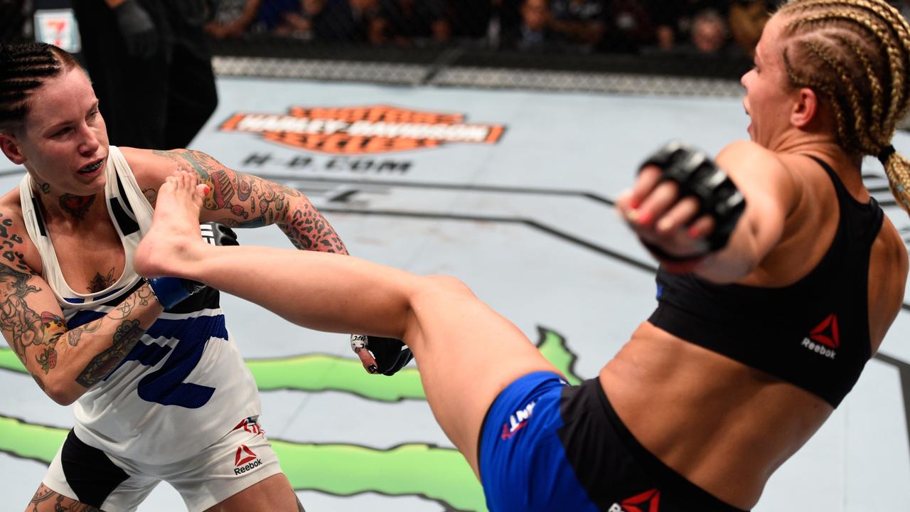 Paige VanZant kicks Bec Rawlings. Photo by Jeff Bottari/Zuffa LLC/Zuffa LLC via Getty Images.