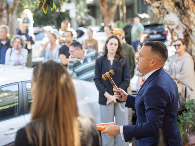 A recent, crowded auction in Alexandria. Agents have reported buyer demand has risen. Picture: Jeremy Piper