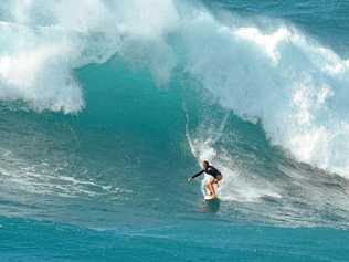 WUNDERKIND: Noosa 13-year-old Amarnie Barber shredding a monster at Waimea Bay in Hawaii. Picture: Craig Barber