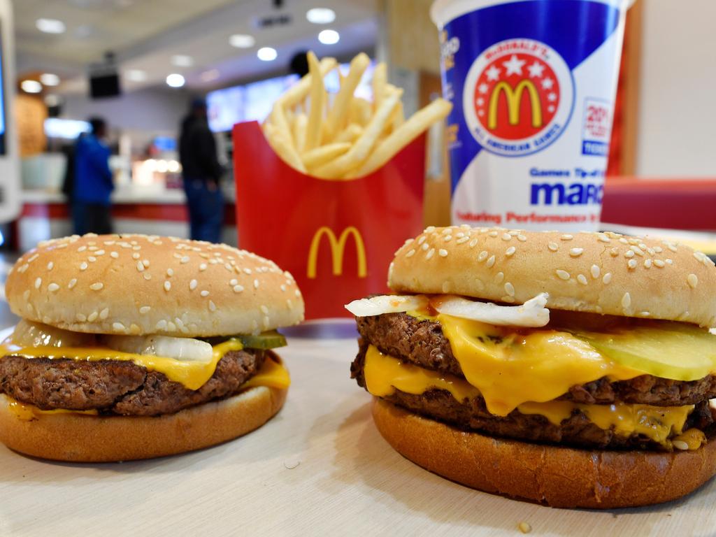A US McDonald's Quarter Pounder, left, and Double Quarter Pounder. As of Wednesday, September 26, the chain says classics like the Big Mac and Quarter Pounder with Cheese are preservative-free, with reformulated buns and sauces. Picture: AP Photo/Mike Stewart