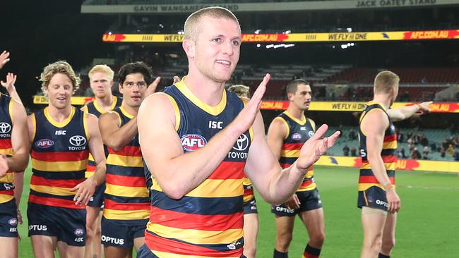 AFL – Tuesday, 8th September, 2020 – Adelaide Crows v GWS Giants at the Adelaide Oval. Adelaide's Andrew McPherson leads the team off after the win – McPherson's first win and the first chance to sing the song Picture: Sarah Reed