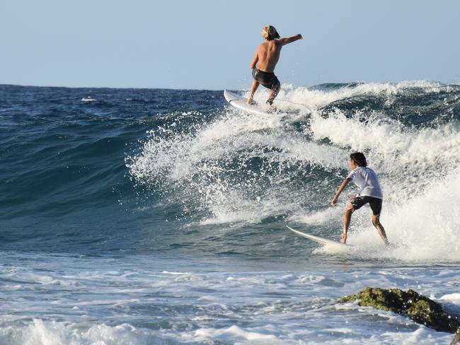 Young swimmers knocked down by swell at Snapper Rocks on the Gold Coast generated by Tropical Cyclone Oma. Picture: Mark Furler