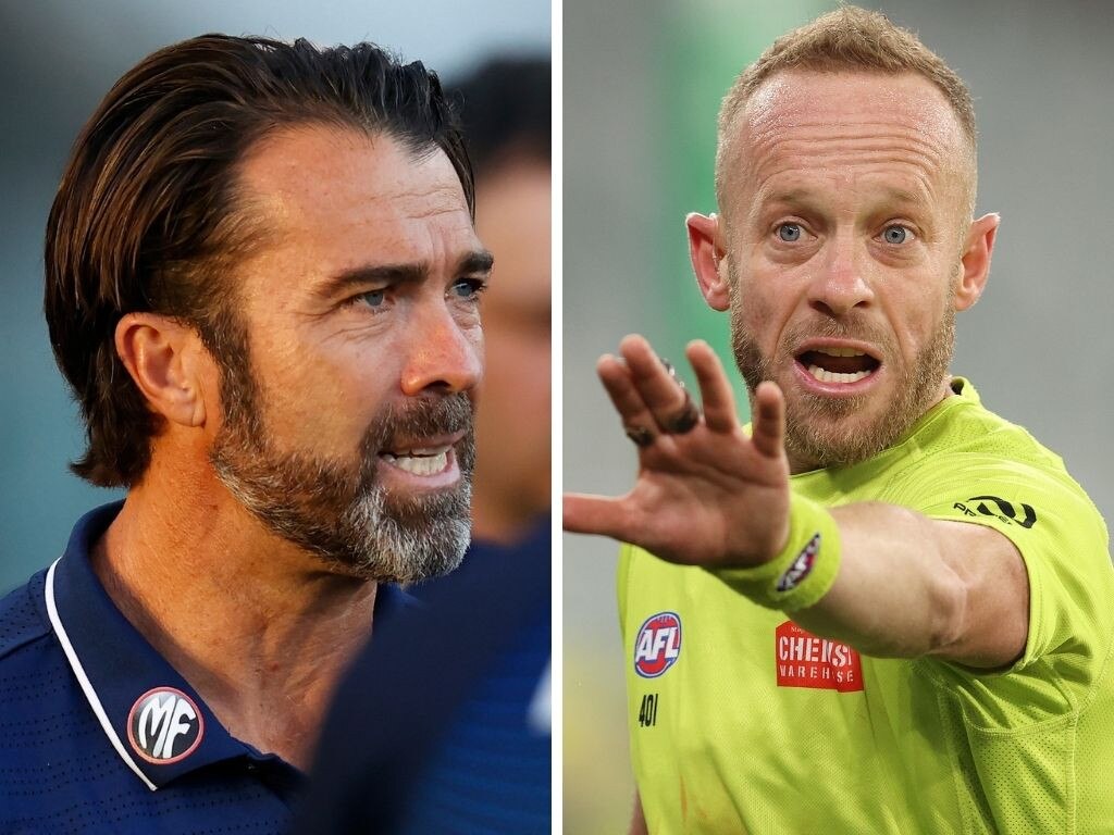 Geelong coach Chris Scott; umpire Ray Chamerlain.