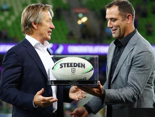 MELBOURNE, AUSTRALIA - MARCH 17: Craig Bellamy, Head Coach of the Storm receives the game ball from Cameron Smith after coaching his 500th NRL game during the round two NRL match between the Melbourne Storm and the South Sydney Rabbitohs at AAMI Park, on March 17, 2022, in Melbourne, Australia. (Photo by Kelly Defina/Getty Images)