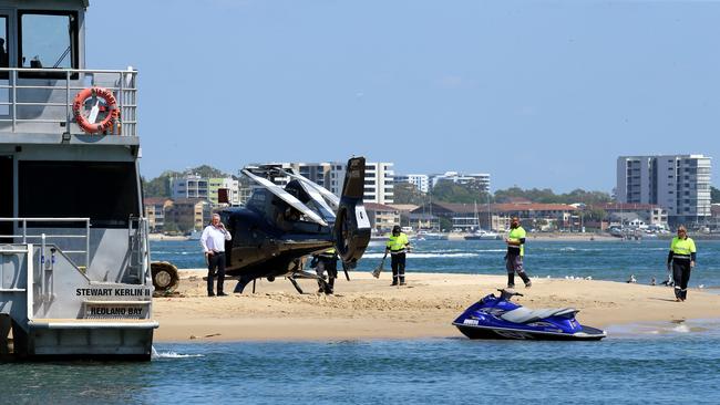 Aircrash investigators and staff from Harvey Towing look over the crash site for more debris. Picture: NewsWire / David Clark