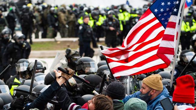 Trump supporters of Donald Trump fight with riot police outside the Capitol building on January 6. Picture: AFP.