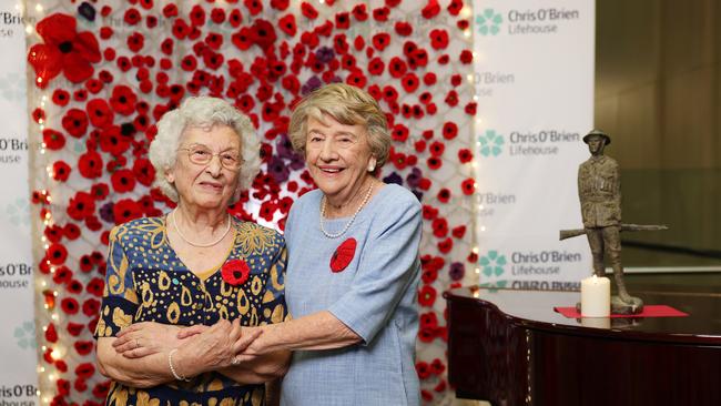 Jessie Grech and Myra Edwards, who helped knit a piece of Anzac artwork to replace a rug stolen from a Sydney hospital earlier this year, at a handover ceremony on Monday. Picture: Rohan Kelly