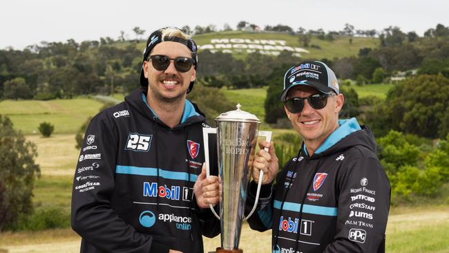 2022 Bathurst 1000 winners Chaz Mostert and Lee Holdsworth pose with the Peter Brock Trophy. Picture: Getty Images