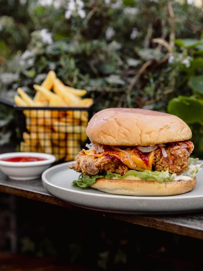 Anju's Korean fried chicken burger includes a tasty burger with cheese, pickled daikon, cos lettuce and gochujang mayo. Picture: Dearna Bond/ DarkLab