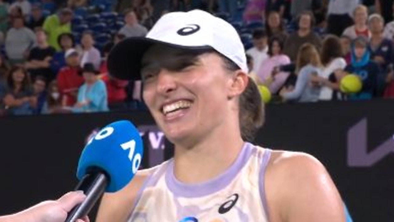 Iga Swiatek is interviewed on court.