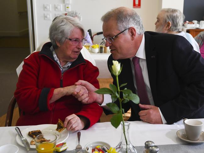 Australian Prime Minister Scott Morrison speaks to a resident during a visit to a Goodwin Retirement Village in Canberra, Wednesday, September 12, 2018. (AAP Image/Lukas Coch) NO ARCHIVING