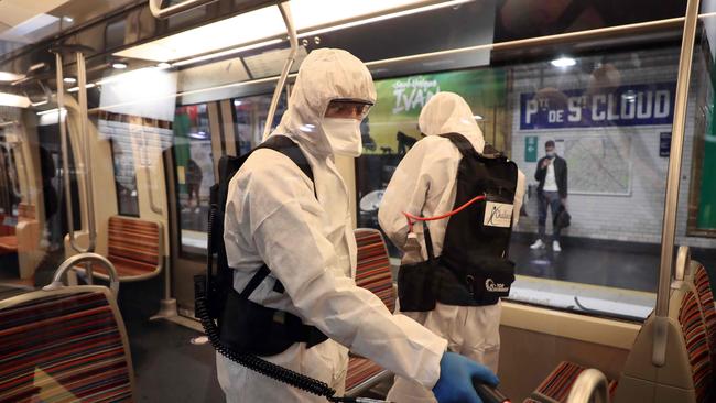 A metro train is cleaned in Paris to prevent coronavirus spreading. Picture: AFP