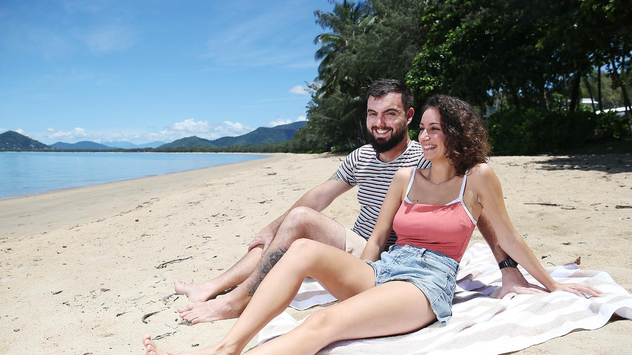 Ana Aparicio and Nicolas Reverte enjoy a sunny day together at Palm Cove beach. Picture: Brendan Radke