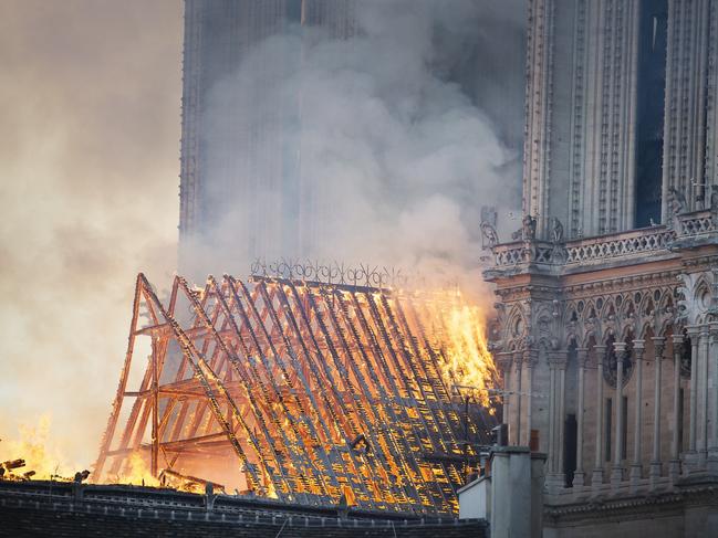 Smoke and flames rise during a fire at the landmark Notre-Dame Cathedral in central Paris on April 15, 2019. Picture: Eliot Blondet /ABACAPRESS.COM/AAP