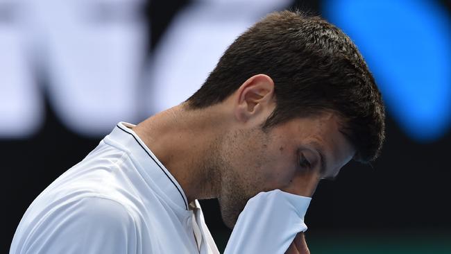 Novak Djokovic reacts during his loss to Denis Istomin in the second round of the 2017 Australian Open. Photo: Paul Crock
