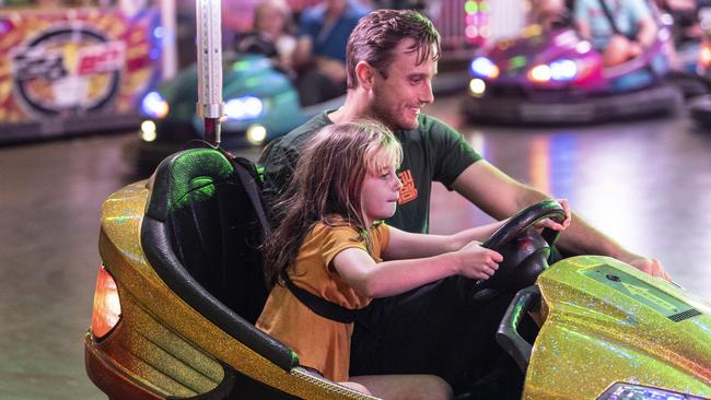 Tim Green and daughter Edison Green on the dodgem cars at Toowoomba Royal Show, Thursday, March 30, 2023. Picture: Kevin Farmer