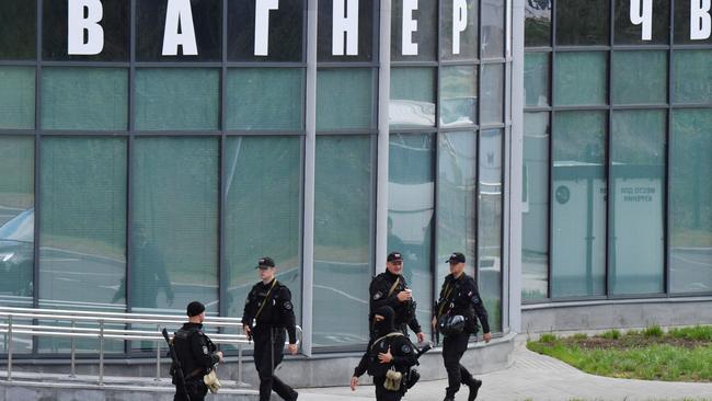 Russian police officers patrol outside PMC Wagner Centre in Saint Petersburg. Picture: AFP.