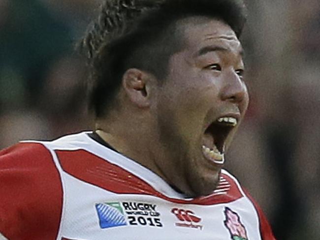 Japan's Kensuke Hatakeyama celebrates victory in the Rugby World Cup Pool B match between South Africa and Japan at the Brighton Community Stadium, Brighton, England Saturday, Sept. 19, 2015. (AP Photo/Tim Ireland)