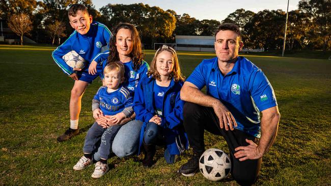 Charlotte and Michael Reimer with kids Bruce, 10, Chelsea, 7, and Luigi, 2, who feared for the future of the eastern suburbs sporting pitch. Picture: Tom Huntley