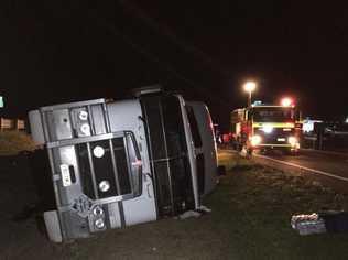 A truck hit a parked car and rolled on the Warrego Highway at Withcott. Picture: WIN News Toowoomba