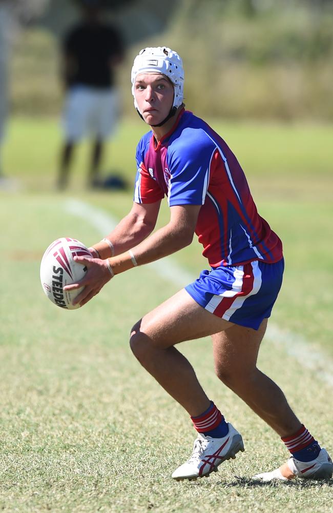 Boys Rugby League State Championship held at Northern Division, Brothers Leagues ground, Townsville. 16-18 years. Peninsula (stripe) v Darling Downs (blue/purple). Braithen Scott of St Mary's College, Toowoomba.