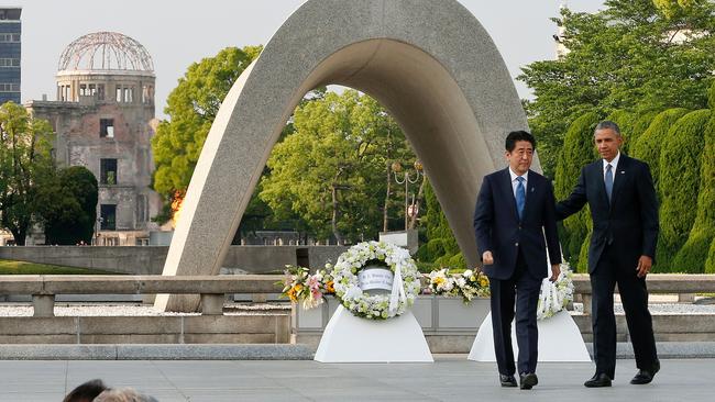US President Barack Obama (right) with Japanese Prime Minister Shinzo Abe after laying wreaths at Hiroshima Peace Memorial Park in Hiroshima.