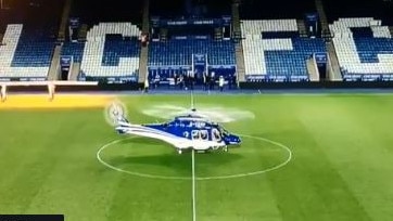 The helicopter routinely lands in the middle of the pitch.