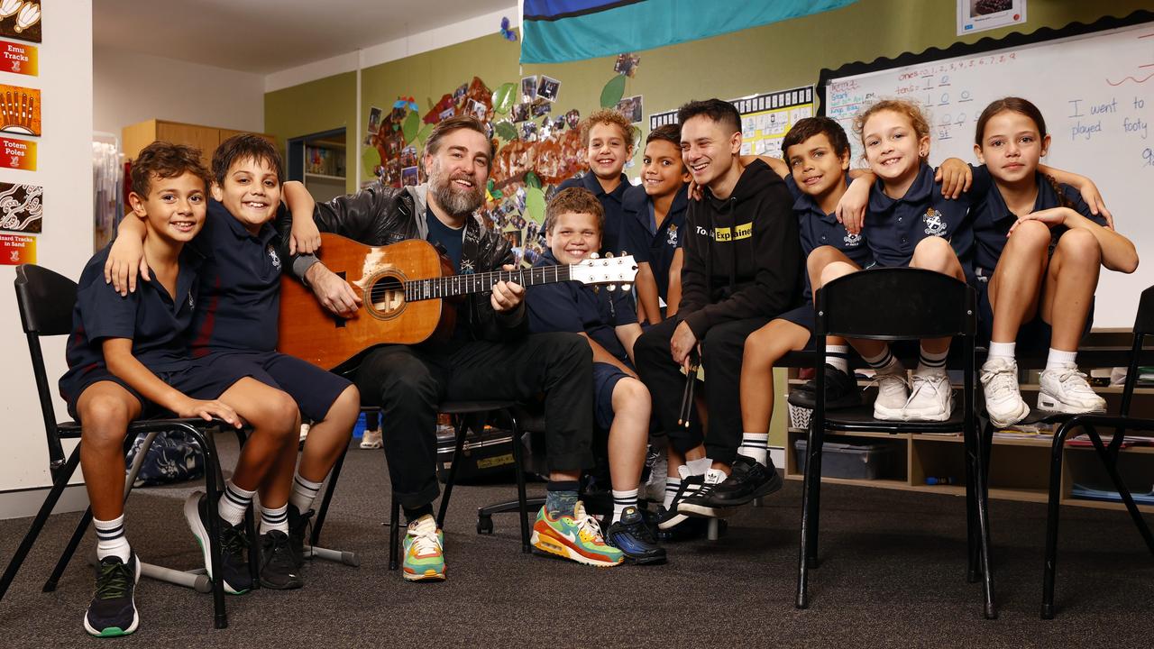 Pictured at St Andrew’s Cathedral Gawura School in Sydney is Australian singer-songwriter Josh Pyke and hip hop artist Rhyan Clapham (DOBBY), with students Yuin-River Johnson, Latrell McGrath, BJ Carr, John Saulo, Marlon Coulthard, Shane Jackson, Bokhara Rossiter and Samara Lyons. Picture: Richard Dobson
