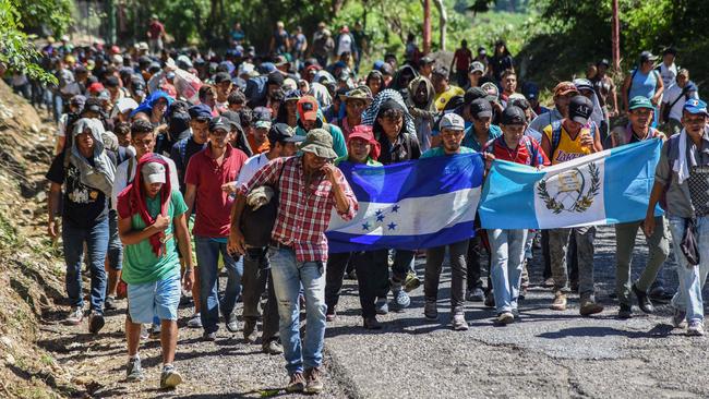 ‘My feet are good’: about a 1000 Honduran migrants yesterday leave Quezaltepeque, Guatemala, in a new caravan headed for the US. Picture: AFP