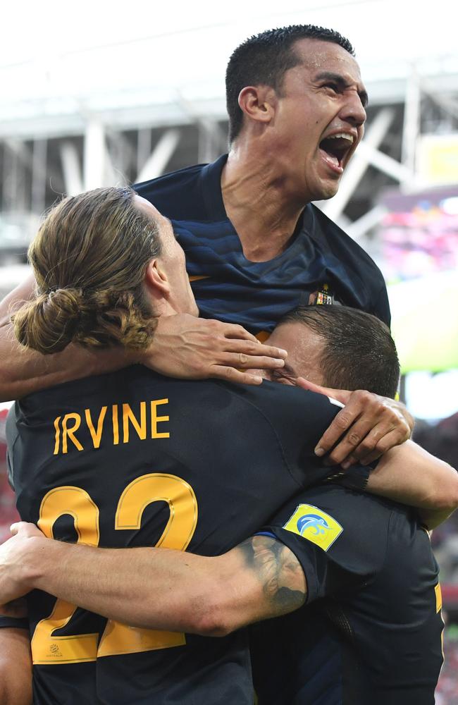 Tim Cahill celebrates James Troisi’s goal against Chile.