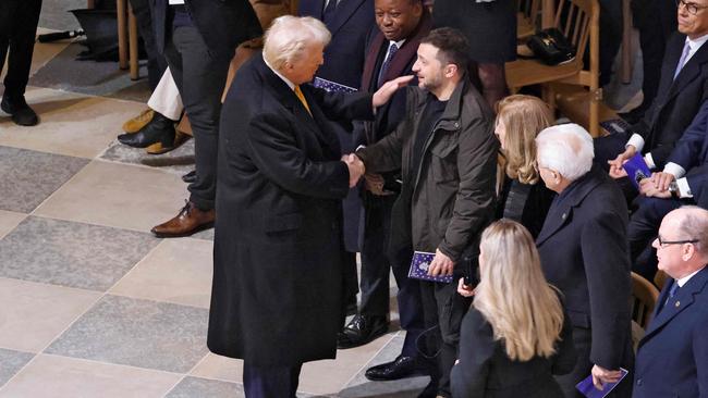 Trump renews acquaintances with Zelensky at the reopening of Notre-Dame Cathedral in December. Picture: AFP