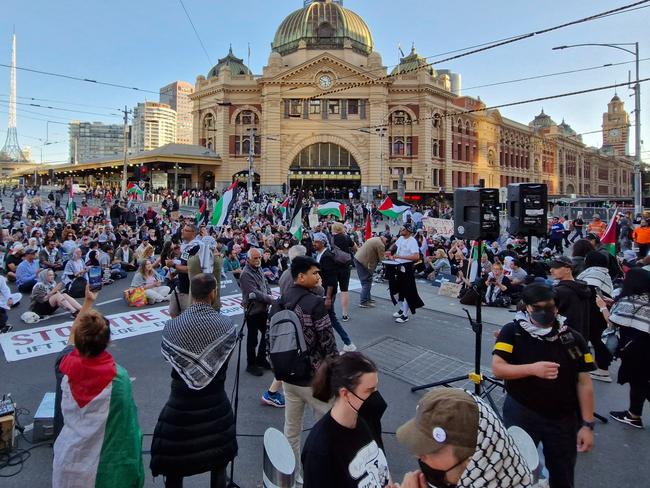 Protesters block off Flinders Street on Thursday night. Picture: Chris Woods/ Twitter @tophermwoods