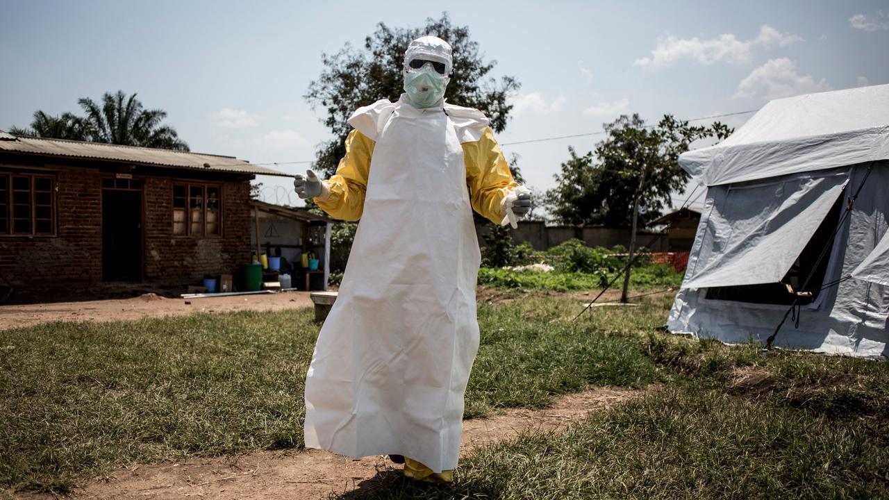 A health worker gets ready to perform medical checks inside an ebola Treatment Centre in Beni. The struggle to contain the latest ebola outbreak in the Democratic Republic of Congo is facing a "perfect storm" of challenges. Picture: AFP