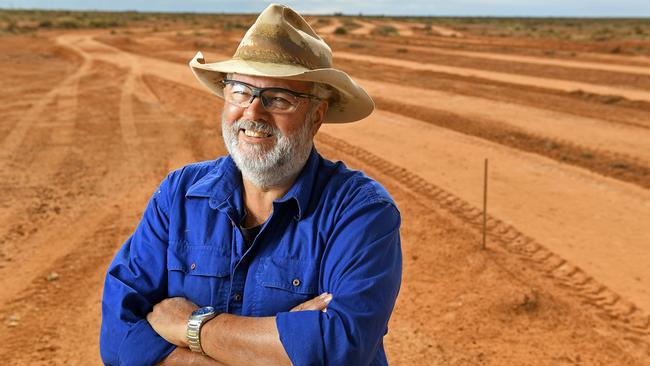 Marree Hotel owner Phil Turner at the site of the Marree man where he recently helped restore the artwork.