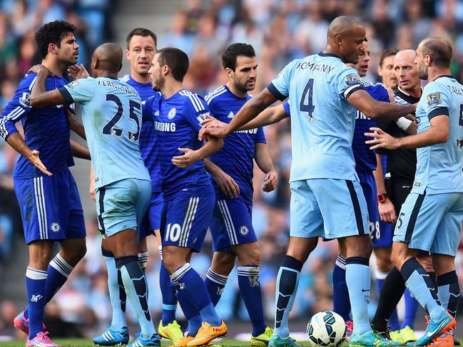 MANCHESTER, ENGLAND - SEPTEMBER 21: Pablo Zabaleta of Manchester City is separated from Diego Costa of Chelsea by his team-mates during the Barclays Premier League match between Manchester City and Chelsea at the Etihad Stadium on September 21, 2014 in Manchester, England. (Photo by Shaun Botterill/Getty Images)