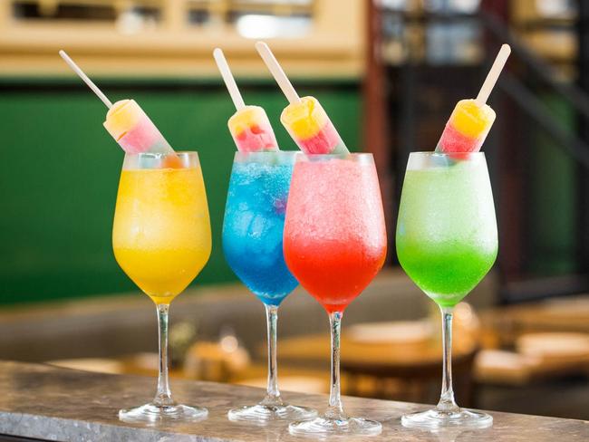 Butcher and the Farmer's rainbow of Mardi Gras Frosés topped with Lifesaver ice blocks. Picture: Supplied