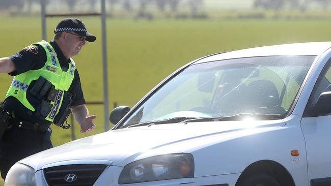 Traffic backed up on the Midland Highway near Ross after a fatal car crash involving multiple cars and victims.