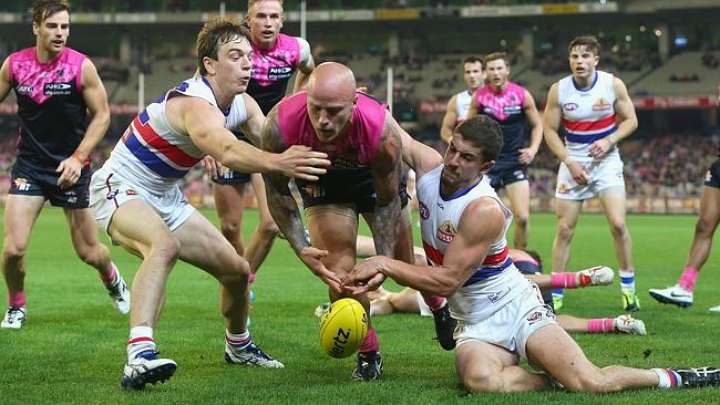 Nathan Jones is brought to ground by Bulldogs star Tom Liberatore and tagger Liam Picken. Picture: Getty