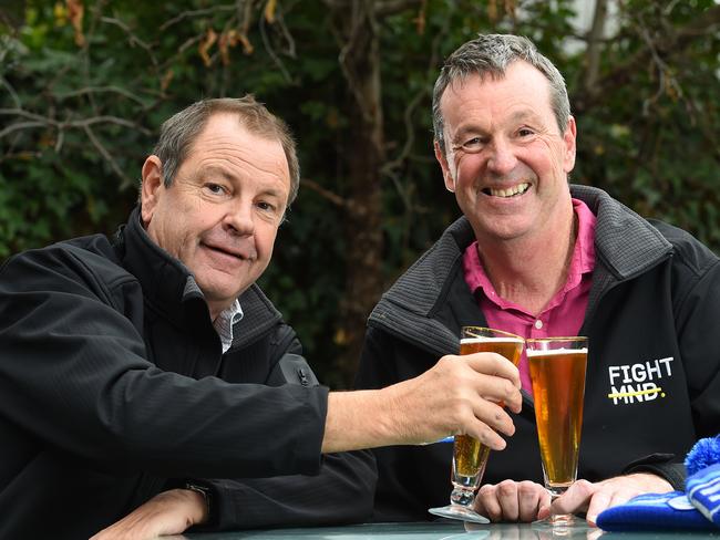 Bill Guest and Neale Daniher enjoy a beer as they discuss FightMND. Picture: Josie Hayden