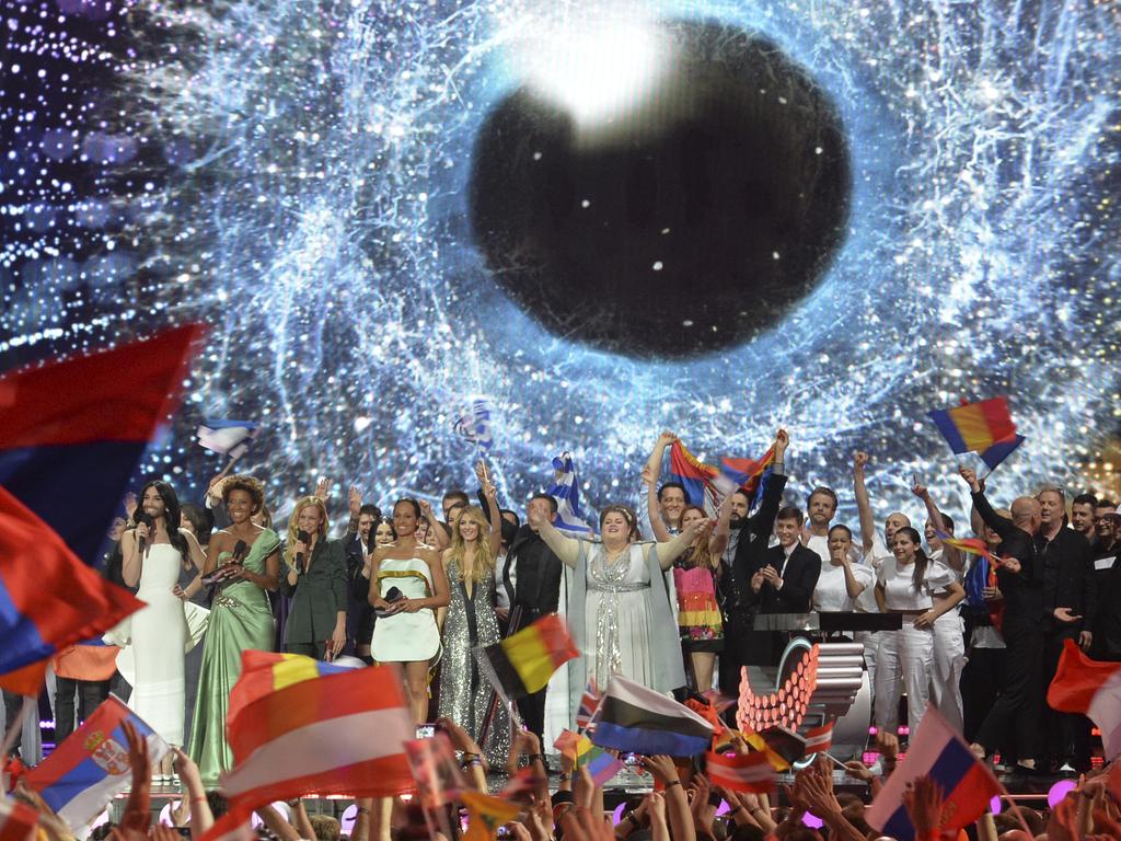 Spectators wave flags as the artists who qualified for the final and the hosts appear on stage during the first semifinal of the Eurovision Song Contest in Austria’s capital Vienna, Tuesday, May 19, 2015. Picture: AP