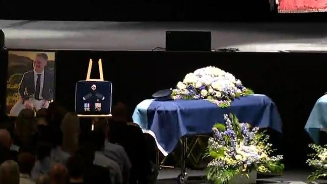 Constable Matthew Arnold’s casket, medals and picture at the service Picture: Sky News,